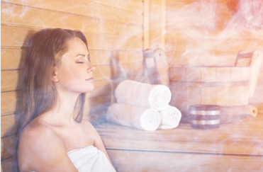 A girl with eyes closed enjoys the sauna at Power lift studio in Boston