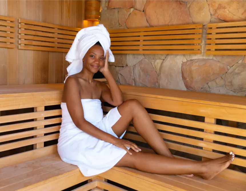 Woman in bathrobe enjoying the post workout recovery sauna at Power lift studio in Boston